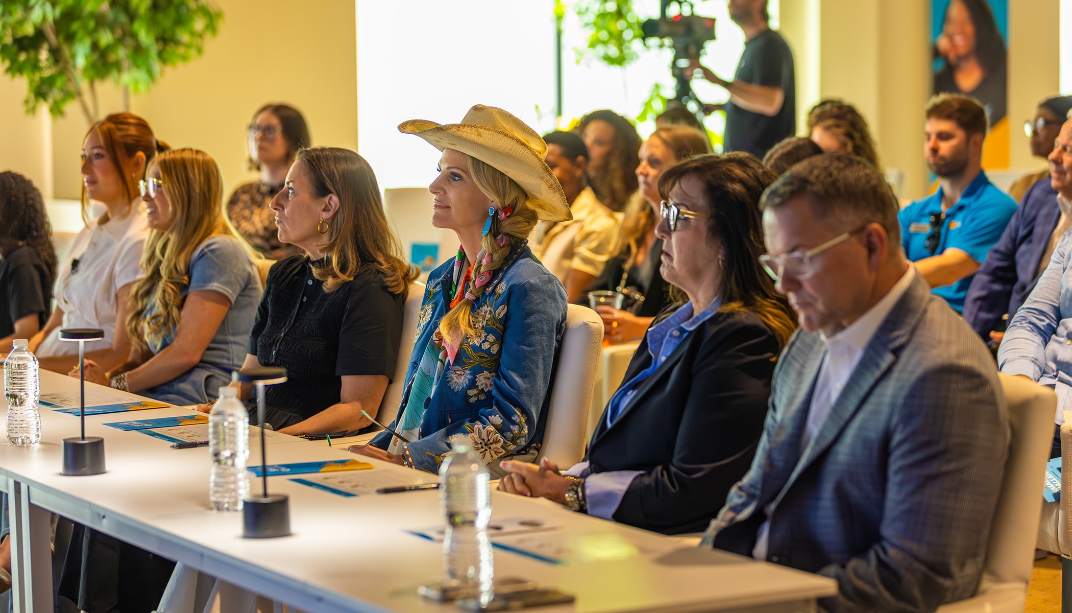 a panel of judges at a table taking notes